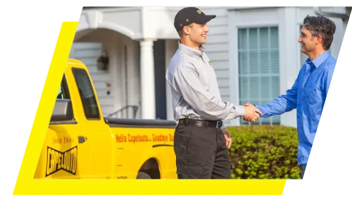 Local Florida resident shaking the hand of a Capelouto Pest technician outside his home.